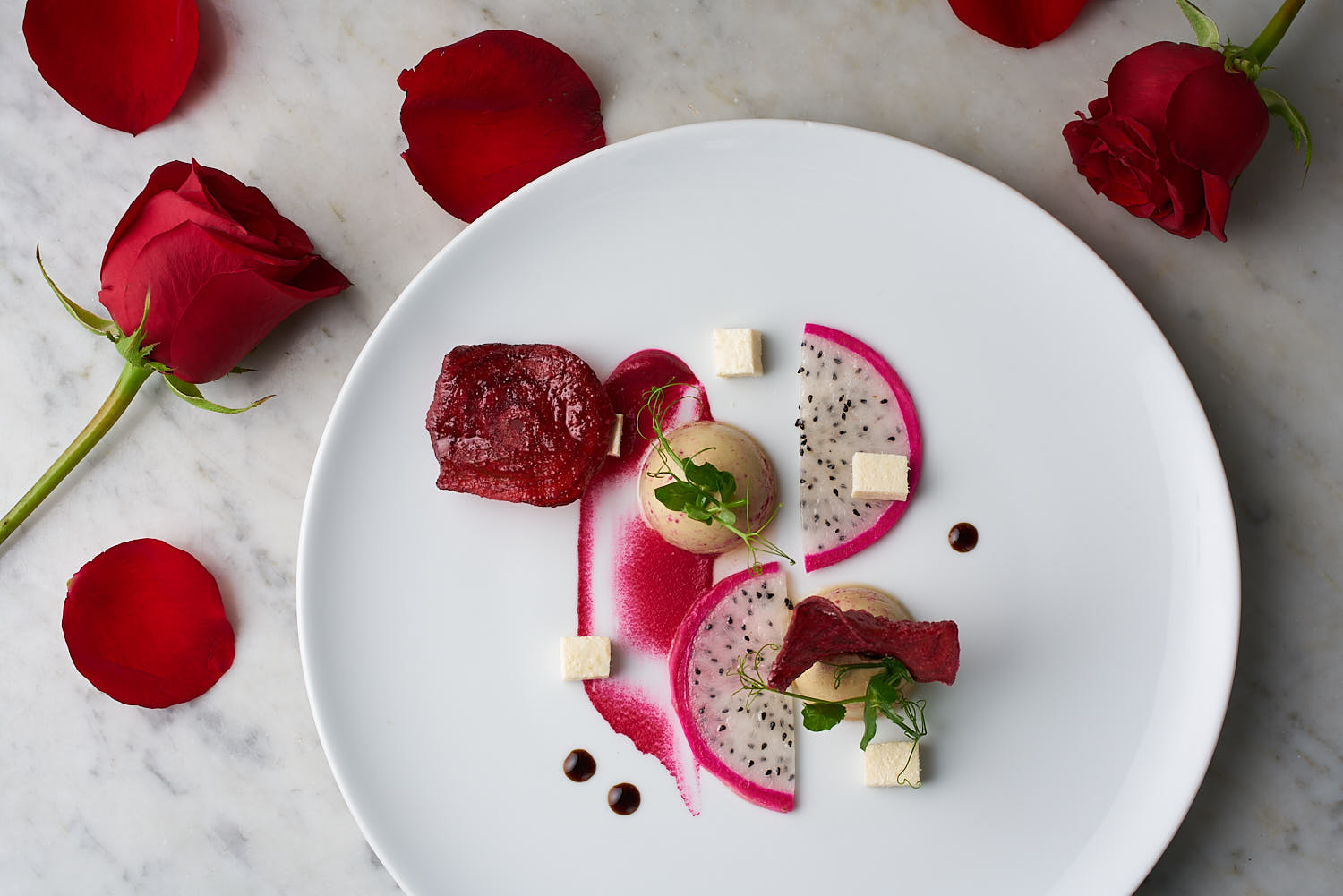 Top-down shot of Valentine’s Day dessert plated at Capella Singapore.